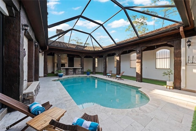 pool with a patio and a lanai