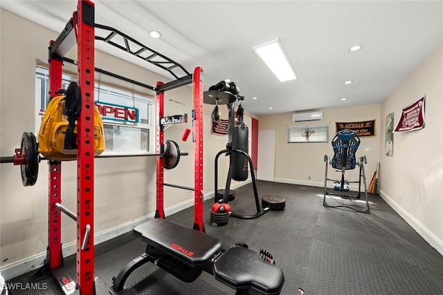 workout area featuring recessed lighting, baseboards, and a wall unit AC