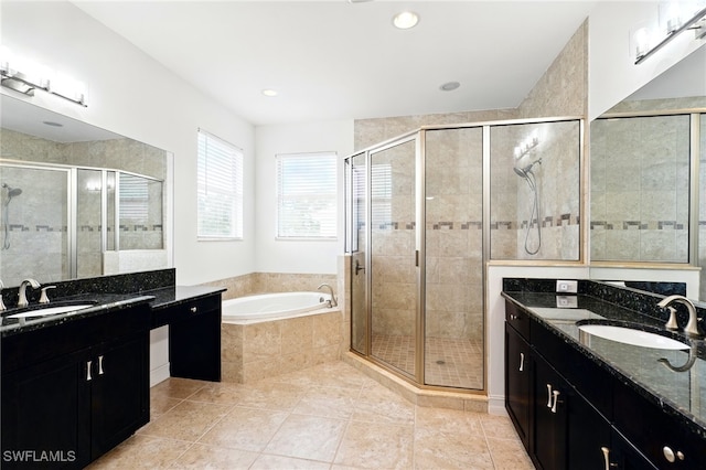 bathroom featuring a garden tub, tile patterned flooring, a sink, and a shower stall