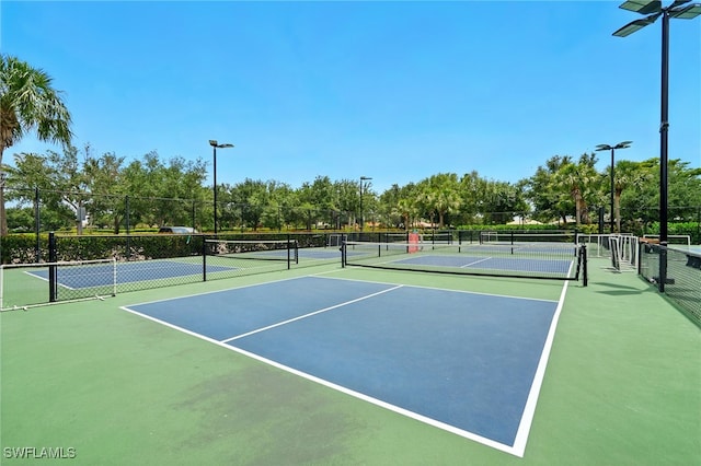 view of sport court with fence
