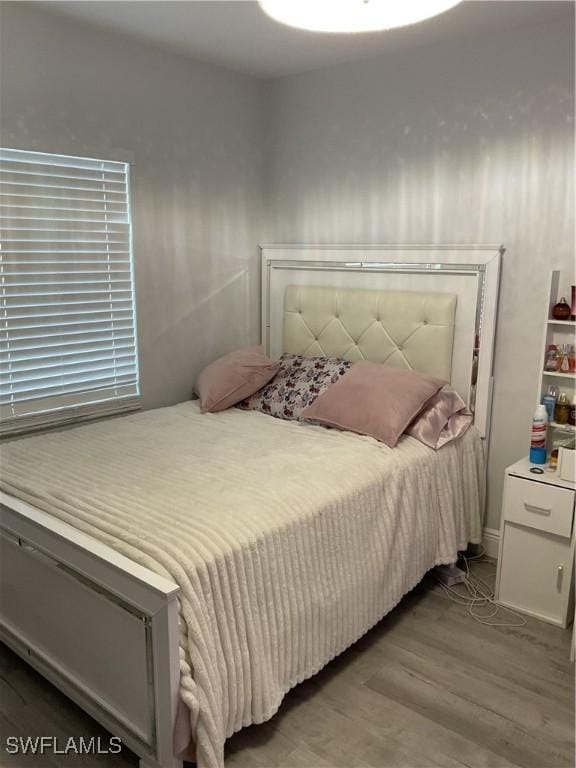 bedroom with wood finished floors