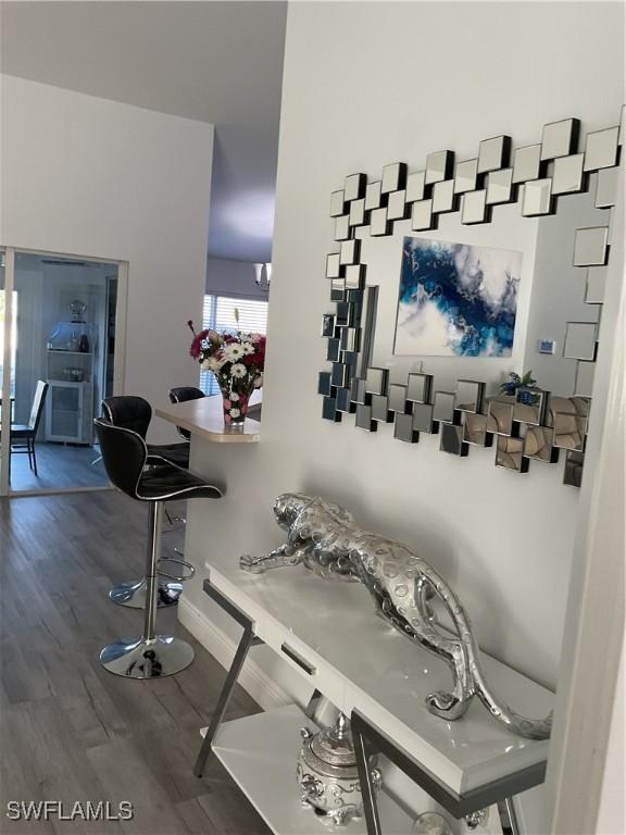 interior space with baseboards and wood finished floors