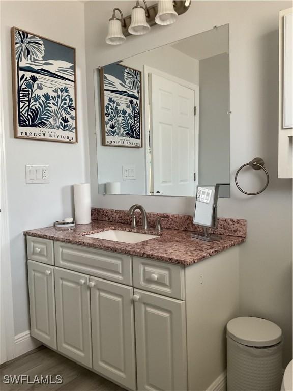 bathroom featuring vanity and baseboards