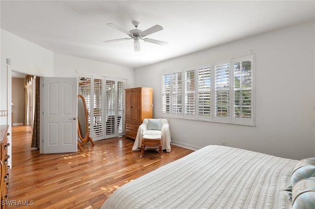 bedroom with baseboards, ceiling fan, light wood-style flooring, and access to exterior