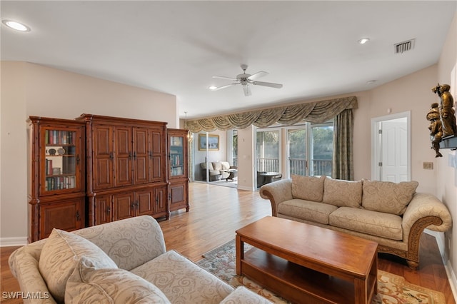 living area with recessed lighting, a ceiling fan, light wood-type flooring, and visible vents