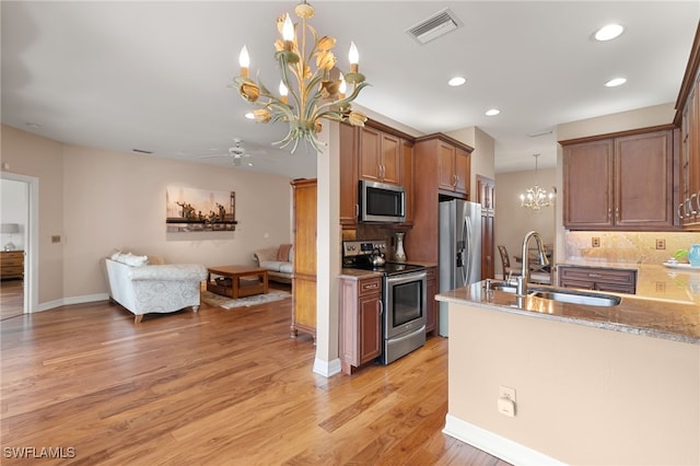 kitchen with backsplash, visible vents, open floor plan, stainless steel appliances, and recessed lighting