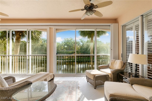 sunroom / solarium with a water view