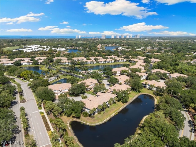 birds eye view of property featuring a water view and a residential view