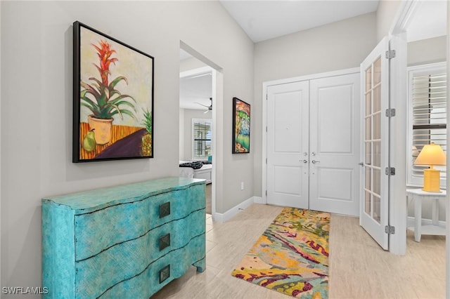 16166 Herons View Dr, Alva, FL 33920 - foyer entrance with baseboards, french doors, and light wood-style flooring