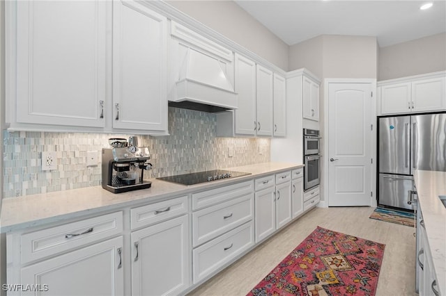 16166 Herons View Dr, Alva, FL 33920 - kitchen with light stone counters, tasteful backsplash, white cabinets, and stainless steel appliances