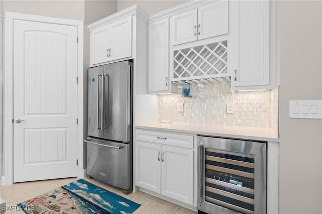16166 Herons View Dr, Alva, FL 33920 - bar with wine cooler, a bar, backsplash, and high quality fridge