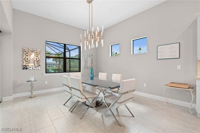16166 Herons View Dr, Alva, FL 33920 - dining room featuring an inviting chandelier and baseboards