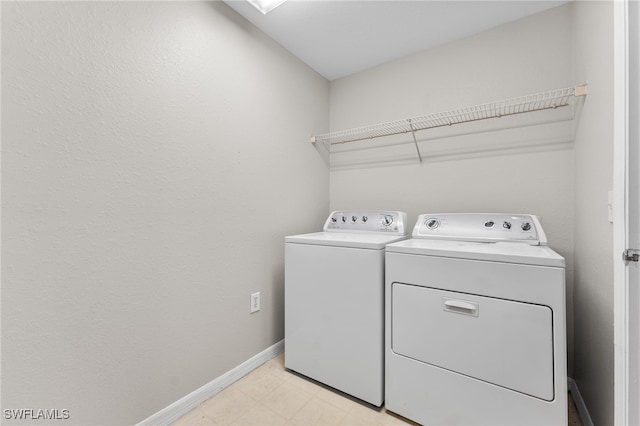 7940 Preserve Cir Unit 914, Naples, FL 34119 - washroom with independent washer and dryer, baseboards, and light flooring