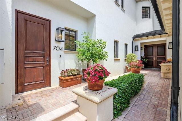 16653 Toscana Cir Unit 704, Naples, FL 34110 - property entrance featuring stucco siding and french doors