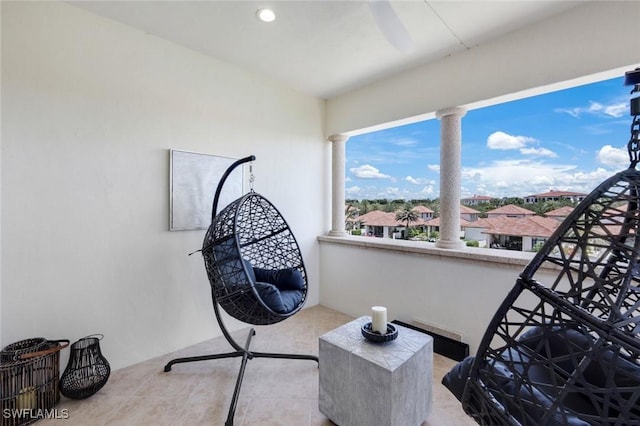 16653 Toscana Cir Unit 704, Naples, FL 34110 - sitting room featuring decorative columns and tile patterned flooring