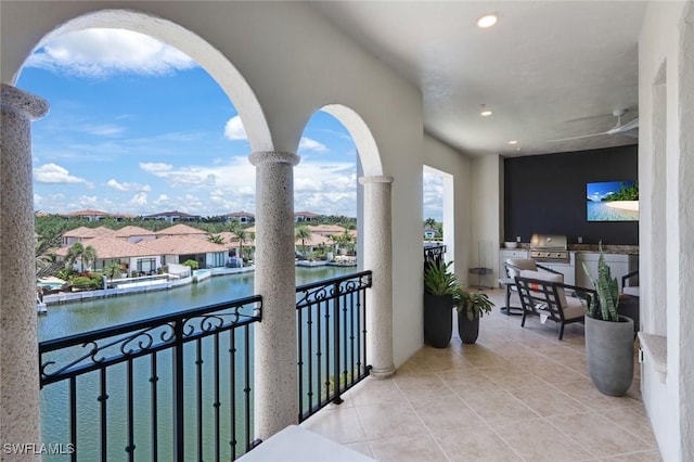 16653 Toscana Cir Unit 704, Naples, FL 34110 - balcony with exterior kitchen and a water view