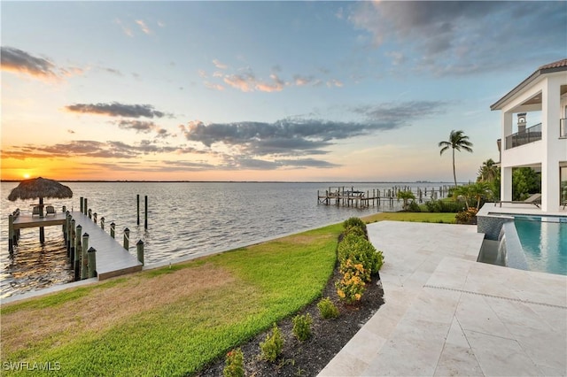 3924 W Riverside Dr, Fort Myers, FL 33901 - view of dock with a lawn, a water view, an outdoor pool, and a patio area