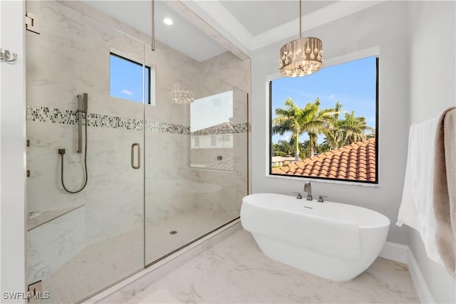 3924 W Riverside Dr, Fort Myers, FL 33901 - full bath featuring a notable chandelier, a marble finish shower, marble finish floor, and a freestanding bath