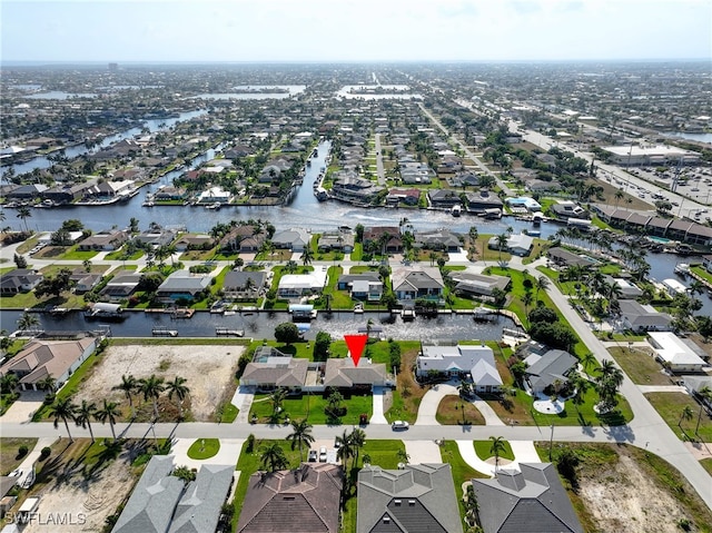 bird's eye view with a water view and a residential view
