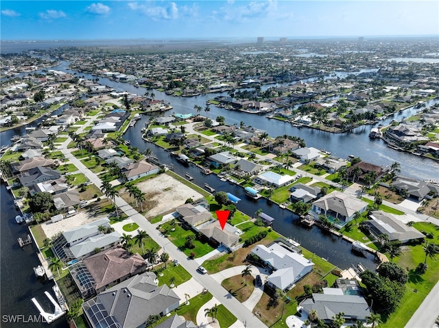 bird's eye view featuring a residential view and a water view