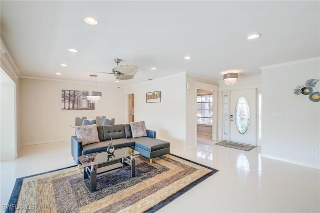 living room with baseboards, recessed lighting, an inviting chandelier, and crown molding