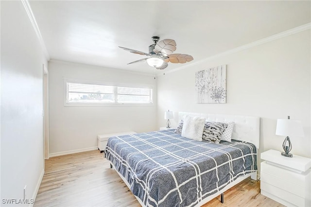 bedroom featuring wood finished floors, ceiling fan, crown molding, and baseboards