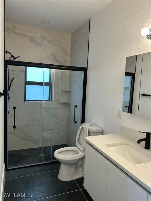 961 Countess Ave, Lehigh Acres, FL 33974 - bathroom with a marble finish shower, toilet, vanity, a textured wall, and tile patterned floors