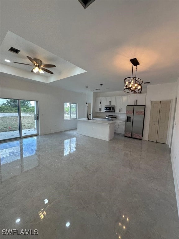 961 Countess Ave, Lehigh Acres, FL 33974 - unfurnished living room featuring ceiling fan, baseboards, and light marble finish floors