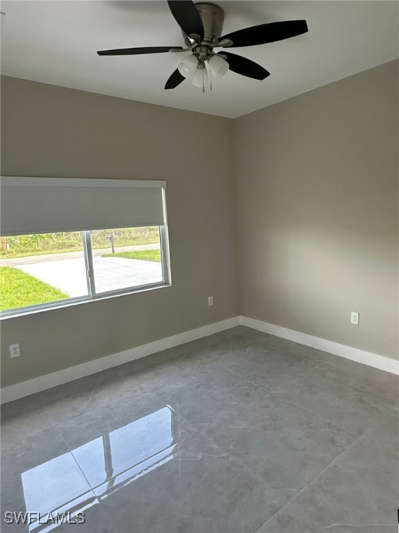 961 Countess Ave, Lehigh Acres, FL 33974 - spare room featuring concrete floors and a ceiling fan