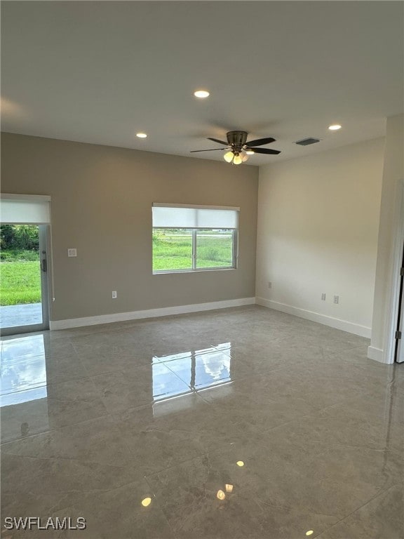 961 Countess Ave, Lehigh Acres, FL 33974 - unfurnished room featuring plenty of natural light, recessed lighting, and a ceiling fan