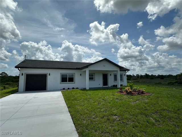 961 Countess Ave, Lehigh Acres, FL 33974 - view of front of property with a garage, concrete driveway, a front lawn, and stucco siding