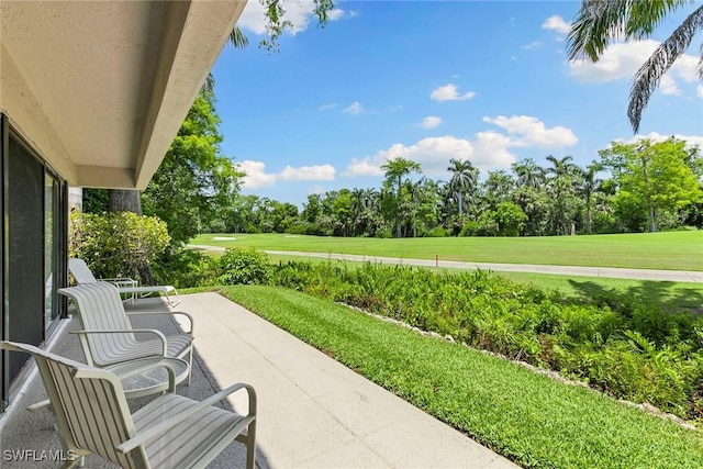 105 Wilderness Dr Unit B105, Naples, FL 34105 - view of patio / terrace featuring golf course view