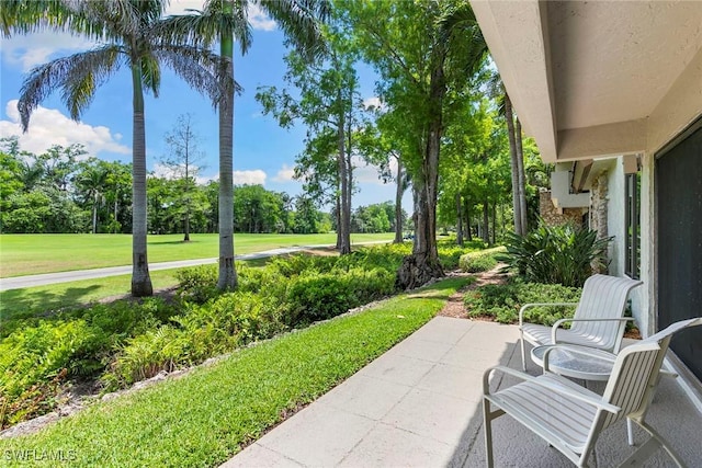 105 Wilderness Dr Unit B105, Naples, FL 34105 - view of patio / terrace