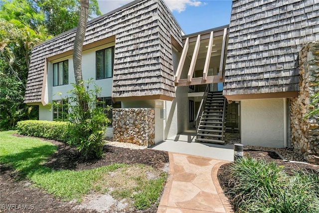 105 Wilderness Dr Unit B105, Naples, FL 34105 - exterior space with stairway