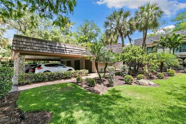 105 Wilderness Dr Unit B105, Naples, FL 34105 - view of yard with a carport