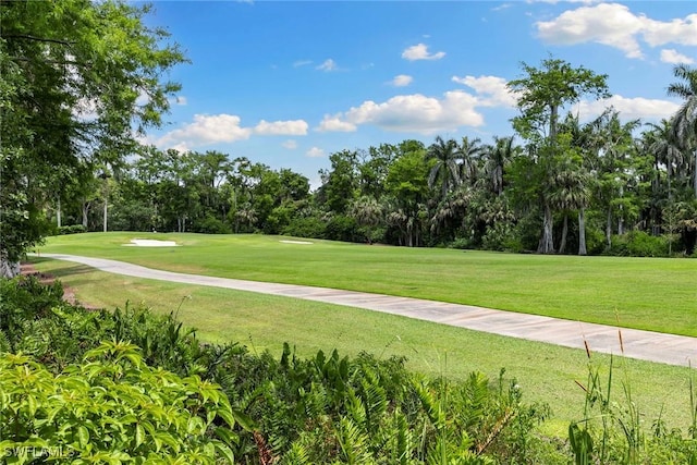 105 Wilderness Dr Unit B105, Naples, FL 34105 - view of property's community with view of golf course and a yard