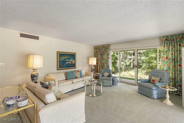 105 Wilderness Dr Unit B105, Naples, FL 34105 - living area with a textured ceiling, visible vents, and carpet floors