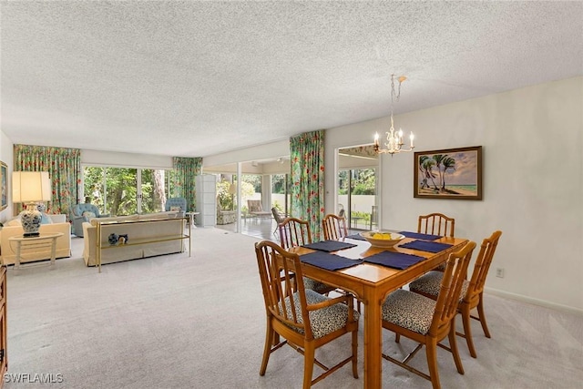 105 Wilderness Dr Unit B105, Naples, FL 34105 - carpeted dining area featuring an inviting chandelier and a textured ceiling