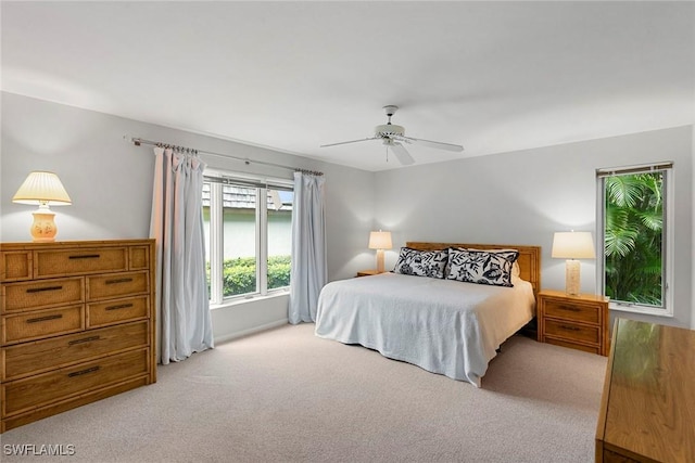 105 Wilderness Dr Unit B105, Naples, FL 34105 - bedroom with a ceiling fan and light colored carpet