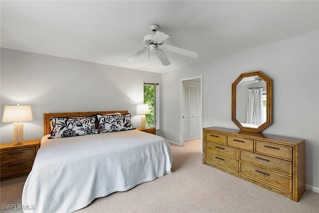 105 Wilderness Dr Unit B105, Naples, FL 34105 - bedroom with baseboards, ceiling fan, and light colored carpet