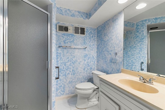 105 Wilderness Dr Unit B105, Naples, FL 34105 - bathroom featuring a shower stall, wallpapered walls, toilet, vanity, and tile patterned flooring
