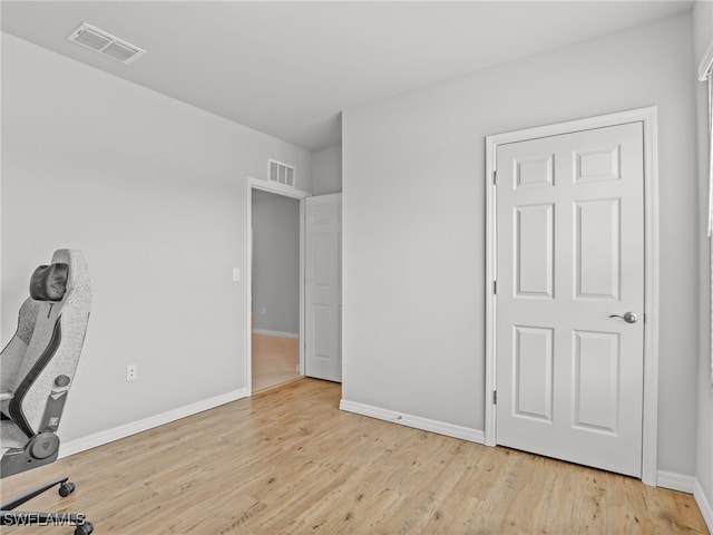 26480 Chaparel Dr, Bonita Springs, FL 34135 - unfurnished office featuring visible vents, baseboards, and wood finished floors