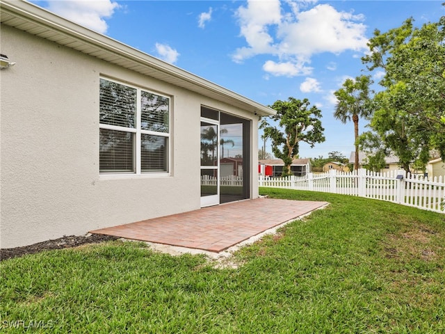 26480 Chaparel Dr, Bonita Springs, FL 34135 - view of yard featuring fence and a patio area