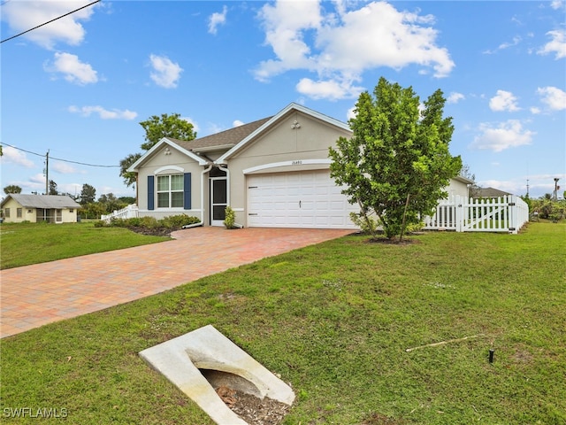 26480 Chaparel Dr, Bonita Springs, FL 34135 - ranch-style house featuring fence, a front lawn, a garage, stucco siding, and decorative driveway