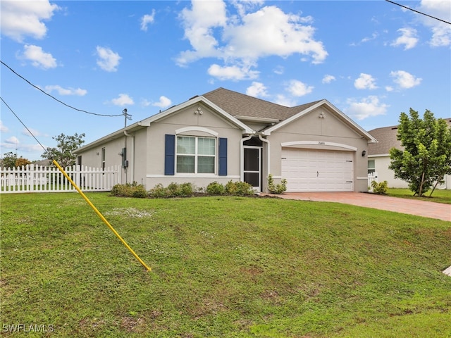 26480 Chaparel Dr, Bonita Springs, FL 34135 - single story home with fence, an attached garage, a front lawn, stucco siding, and driveway