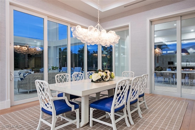 188 W St, Naples, FL 34108 - dining space with a chandelier and wood finished floors