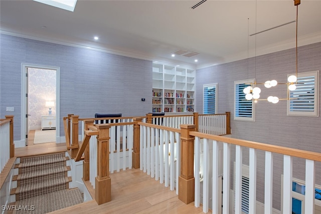 188 W St, Naples, FL 34108 - staircase featuring wallpapered walls, ornamental molding, wood finished floors, recessed lighting, and a chandelier