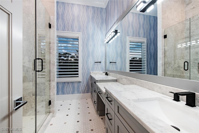188 W St, Naples, FL 34108 - bathroom featuring baseboards, a shower stall, wallpapered walls, and double vanity