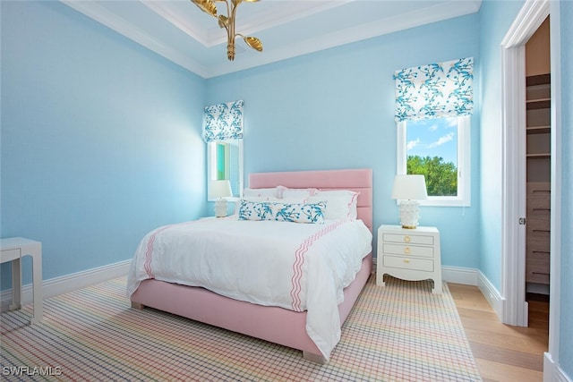 188 W St, Naples, FL 34108 - bedroom with multiple windows, baseboards, and wood finished floors