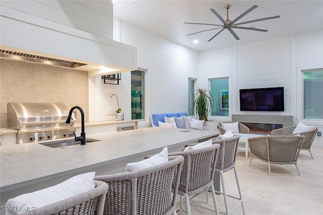 188 W St, Naples, FL 34108 - kitchen featuring ceiling fan, open floor plan, light countertops, and a sink